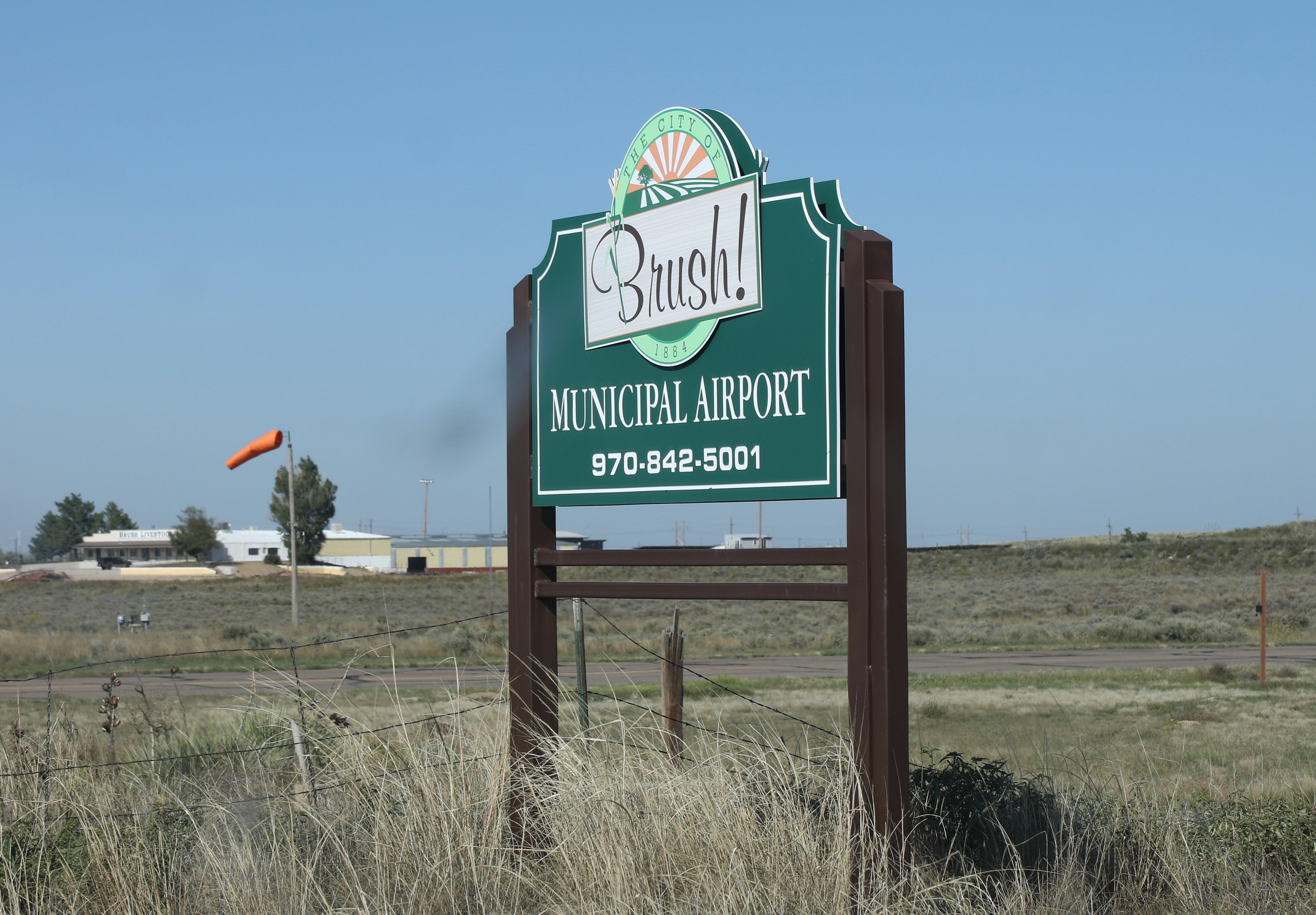  @ Brush Municipal Airport - road sign - by olivier Cortot