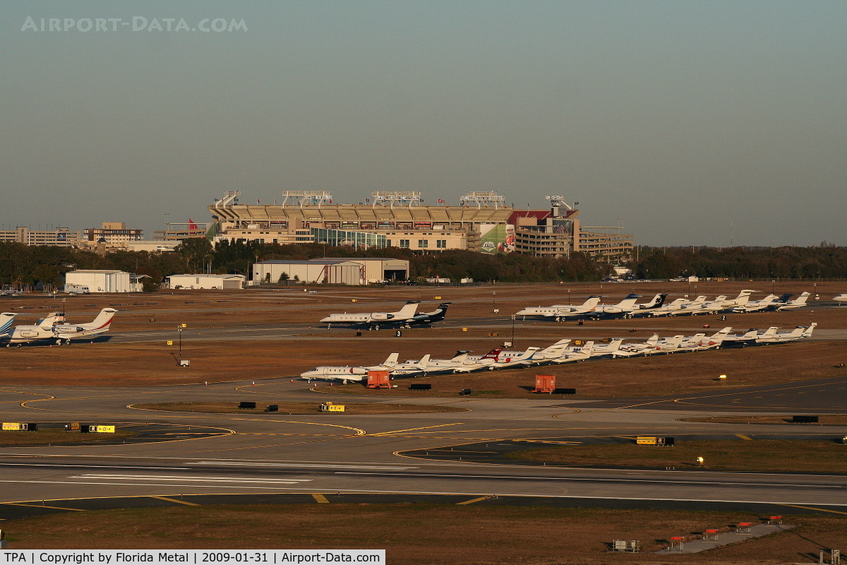 Tampa International Airport (TPA) - Aircraft in for the Superbowl, Raymond James Stadium (where Superbowl was played) in background