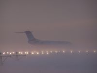 John Paul II International Airport Kraków-Balice, Kraków Poland (KRK) - fog and fokker 100 in holding point rwy 25 - by Artur Badoń