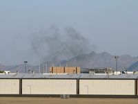 North Las Vegas Airport (VGT) - I was shooting at VGT & looked towards the taxi area to see if anything new was coming up. This is what I saw. My house is located in that direction and I almost went home. But hey, there is an airplane in the shot! - by Brad Campbell