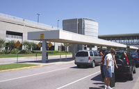 Pensacola Gulf Coast Regional Airport (PNS) - Street entrance with garage on left. - by Bill Larkins