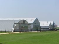 Sywell Aerodrome Airport, Northampton, England United Kingdom (EGBK) - View of hangars at Northampton (Sywell) aerodrome - by Simon Palmer