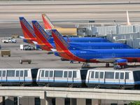 Harry Reid International Airport (LAS) - The 'C' Gates where Southwest Airlines docks. One of the Trams in foreground headed to 'D' Gates - by Brad Campbell