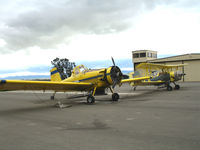 Mesa Del Rey Airport (KIC) - Soilserv's two fixed-winged dusters resting between aerial applications of sulfer on winegrapes (Mesa Del Rey Airport, King City, CA) - by Steve Nation