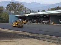 Santa Paula Airport (SZP) - Grading newly resurfaced asphalt aircraft ramp - by Doug Robertson