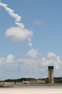 Daytona Beach International Airport (DAB) - Daytona Beach tower with smoke from the Space shuttle taking off in the background - by Florida Metal