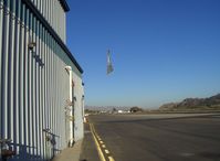Santa Paula Airport (SZP) - Banner Tow Release/Drop over taxiway by N3042M Piper Super Cruiser with 180 Hp, Note the taxying aircraft-usually the drop is on other side of Runway 22 - by Doug Robertson