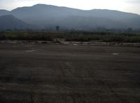 Santa Paula Airport (SZP) - New transient parking tiedown pads anchored in concrete, 3 per airplane-Santa Clara River bed over the bank - by Doug Robertson