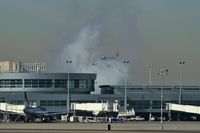 Harry Reid International Airport (las) - A better shot of the smoke coming from behind the 'D' Gates Terminal. - by Brad Campbell