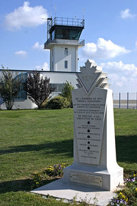 Caen Carpiquet Airport - The tower of Caen with in front the statue to remember the Canadian soldiers who liberated the airport in 1944 - by Connector