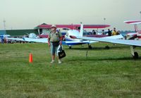 Wittman Regional Airport (OSH) - Don found the next thing to Heaven - by Bob Simmermon