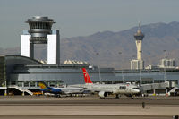 Harry Reid International Airport (LAS) - McCarran ATCT and 'The Strat' - by Brad Campbell