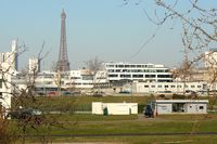 Paris Issy-les-Moulineaux Airport, Paris France (LFPI) - Heliport Paris-Issy with the Eiffel Tower in the background - by Michel Teiten ( www.mablehome.com )