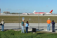 Miami International Airport (mia) - Credit to Miami Airport for still continuing to provide an authorised place to take photographs - complete with dedicated holes cut in the fence - by Terry Fletcher
