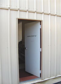 Santa Paula Airport (SZP) - Door to Hangar 2 of 2. Legendary Aircraft LLC, 70% scale TF-51, P-51D MUSTANGS in Area 51. - by Doug Robertson