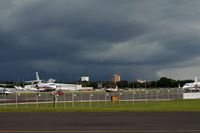 Executive Airport (ORL) - Orlando Executive Airport with Downtown Orlando and storm in background - by Florida Metal