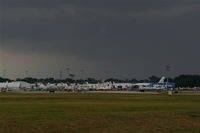Executive Airport (ORL) - Storm clouds gather over NBAA Orlando - by Florida Metal