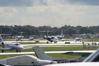 Executive Airport (ORL) - Line up of departing aircraft on NBAA last day - by Florida Metal