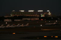 Tampa International Airport (TPA) - Night view of Tampa ramp and Raymond James Stadium - by Florida Metal