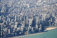Chicago O'hare International Airport (ORD) - United Airlines Ted Airbus A320-232 N458UA on approach to 27L KORD with a view of the Windy City.. - by Mark Kalfas