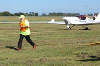 Grimes Field Airport (i74) - Sam hustling to park a plane at the MERFI fly-in. - by Bob Simmermon