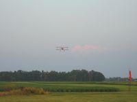 Forest Field Airport (9OH9) - Low pass by N260DH over the strip during the TOPA cookout. - by Bob Simmermon
