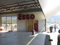 Santa Paula Airport (SZP) - 32 Curtiss Taxi-New hangar under construction. ESSO sign (Canadian fuel) - by Doug Robertson