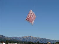 Santa Paula Airport (SZP) - Banner Tow Pickup on First Pass by N3042M - by Doug Robertson