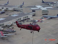 Orlando International Airport (MCO) - vintage Sikorsky lifting a new X band radar to the top of ATCT - by Jeff MacManus
