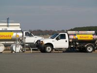 Wayne Executive Jetport Airport (GWW) - AvGas Truck (right) and JET A Truck (left) at Goldsboro-Wayne - by George Zimmerman