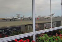 Napa County Airport (APC) - Full bizjet ramp reflected in terminal window - by Steve Nation