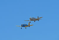 Watsonville Municipal Airport (WVI) - BT-13 N71502 silver Marines M-201 and N65364 USAAC colors on final approach @ 2010 Watsonville fly-in - by Steve Nation