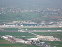 Turin International Airport (Torino Caselle Airport) - Overview of Turin airport from the right downwind of runway 36 while an ATR72 of Air Dolomiti is landing. - by Cerutti Paolo