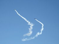Santa Paula Airport (SZP) - N779LH and N999ST spectacular smoke formation arrival over SZP's First Sunday Aviation Museum Fly-In prior to tandem landing Rwy 04 - by Doug Robertson