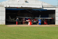 Lashenden/Headcorn Airport, Maidstone, England United Kingdom (EGKH) - Busy morning in the maint hangar. - by Martin Browne