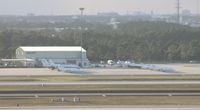 Orlando International Airport (MCO) - C-20s and T-1s on west ramp - by Florida Metal