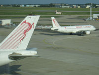 Paris Orly Airport, Orly (near Paris) France (LFPO) - The tail belongs to TS-IPA, one of the four A300-600s in service with Tunisair. Departing A320-211 TS-IMM was heading to runway 08/26 - by Alain Durand