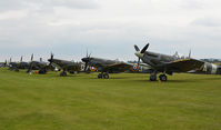 Duxford Airport, Cambridge, England United Kingdom (EGSU) - THE FLIGHT LINE AT THE 75TH ANNIVERSARY OF THE SPITFIRE AIRSHOW. - by Martin Browne