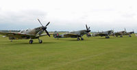 Duxford Airport, Cambridge, England United Kingdom (EGSU) - PART OF THE FLIGHT LINE AT DUXFORD ON 4TH SEP 2011. A VERY DULL AND RAINY DAY. - by Martin Browne