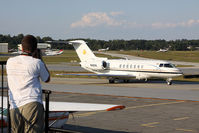 Dekalb-peachtree Airport (PDK) - From the spotting location at PDK, a person photographs a nice Hawker 4000, N40VK as it taxis by for departure. - by Dean Heald