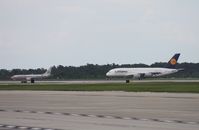 Orlando International Airport (MCO) - A380 lining up to depart on Runway 18R - by Florida Metal