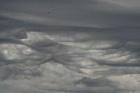 Beloit Airport (44C) - Pic#2 during parachute drop with unusual clouds in background! - by Becky Thompson