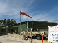 Santa Paula Airport (SZP) - Rwy 22 Windsock in a strong wind with gusts forcing some landing go-arounds on Rwy 22. The green hangar behind is one of the ex-Steve McQueen hangars at SZP where he once lived and learned to fly. Pete Mason was his CFI. - by Doug Robertson