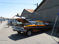 Santa Paula Airport (SZP) - First Sunday Aviation Museum of Santa Paula Open House & Fly-In invites car clubs-this is a Chevrolet hardtop coupe half-jacked with chromed hydraulics located in open trunk. - by Doug Robertson