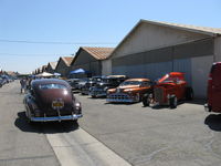 Santa Paula Airport (SZP) - First Sunday Aviation Museum of Santa Paula Open House & Fly-In invites car clubs-four rows of hangars blocked with old restored, custom cars by permission. - by Doug Robertson