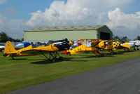 EGBR Airport - from L to R G-RLWG Ryan ST3KR, G-AXMT Bücker Bu-133C Jungmeister, G-TAFF CASA 1-131-E3B and G-AKAT Miles M14A Hawk Trainer 3 - by Chris Hall