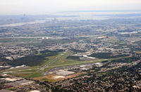 Teterboro Airport (TEB) - With Teterboro Airport in the foreground (seen from the northern end, with the old tower and the Aviation Hall of Fame of New Jersey to the left, we have a panoramic view of Newark, Manhattan, the Hudson, and the Brooklyn Bridge. - by Daniel L. Berek