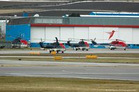 Aberdeen Airport, Aberdeen, Scotland United Kingdom (EGPD) - Some of CHC Scotia's fleet outside their hangar. - by Carl Byrne (Mervbhx)