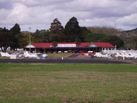 Ardmore Airport, Auckland New Zealand (NZAR) - Flying school end of airfield as seen from through road. Good place to snap landings if coming from west. - by magnaman