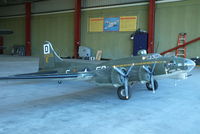 EGBR Airport - large scale model of a B-17 in the hangar at Breighton's Pre Hibernation Fly-in, 2013 - by Chris Hall